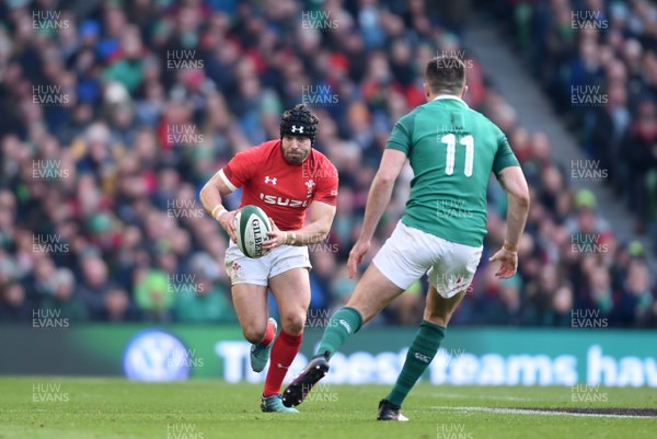 240218 - Ireland v Wales - NatWest 6 Nations 2018 - Leigh Halfpenny of Wales is tackled by Jacob Stockdale of Ireland
