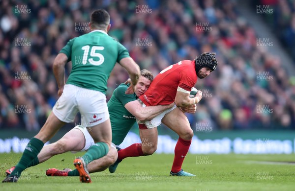 240218 - Ireland v Wales - NatWest 6 Nations 2018 - Leigh Halfpenny of Wales is tackled by Chris Farrell of Ireland