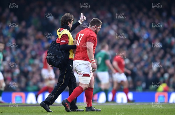 240218 - Ireland v Wales - NatWest 6 Nations 2018 - Wyn Jones of Wales leaves the field with physio Mark Davies