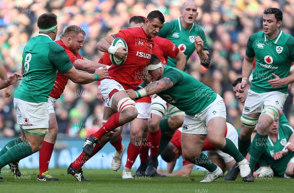 240218 - Ireland v Wales - Natwest 6 Nations - Aaron Shingler of Wales is tackled by Peter O'Mahony of Ireland