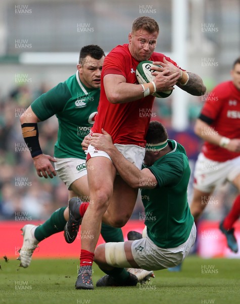 240218 - Ireland v Wales - Natwest 6 Nations - Ross Moriarty of Wales is tackled by Peter O'Mahony of Ireland