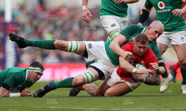 240218 - Ireland v Wales - Natwest 6 Nations - Ross Moriarty of Wales is tackled by Devin Toner of Ireland