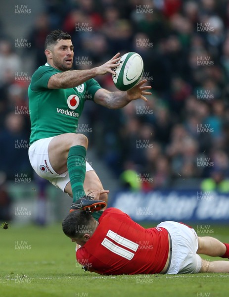 240218 - Ireland v Wales - Natwest 6 Nations - Rob Kearney of Ireland is tackled by Steff Evans of Wales