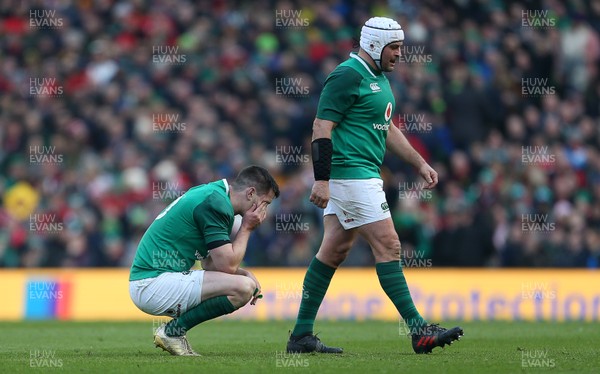 240218 - Ireland v Wales - Natwest 6 Nations - A dejected Johnny Sexton of Ireland as Rory Best walks past