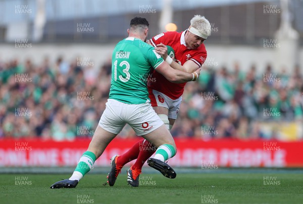 240224 - Ireland v Wales - Guinness 6 Nations Championship - Aaron Wainwright of Wales is tackled by Robbie Henshaw of Ireland 