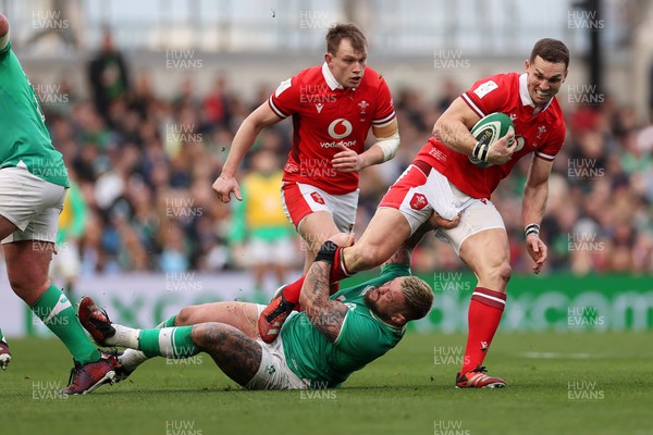 240224 - Ireland v Wales - Guinness 6 Nations Championship - George North of Wales is tackled by Andrew Porter of Ireland 