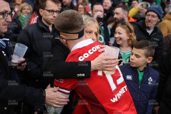 240224 - Ireland v Wales - Guinness 6 Nations Championship - Cameron Winnett of Wales with family at full time