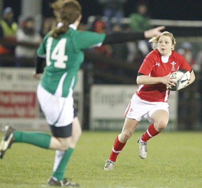 03.02.12 - Ireland Women v Wales Women - Women's Six Nations.Adi Taviner of Wales looks for a gap as Niamh Kavanagh of Ireland awaits developments.