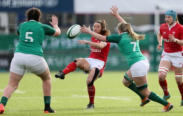 090220 - Ireland Women v Wales Women - Women's 6 Nations Championship - Robyn Wilins of Wales kicks past Edel McMahon of Ireland