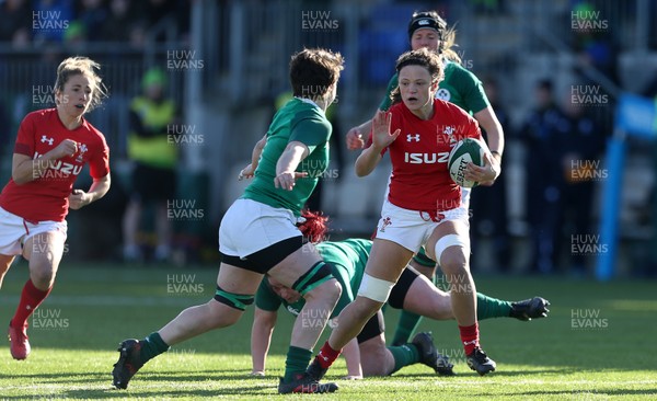 250218 - Ireland Women v Wales Women - Natwest 6 Nations - Alisha Butchers of Wales is tackled by Ciara Griffin of Ireland