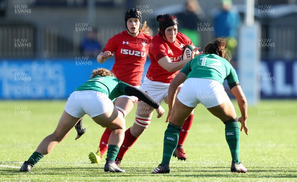 250218 - Ireland Women v Wales Women - Natwest 6 Nations - Mel Clay of Wales is tackled by Katie Fitzhenry of Ireland