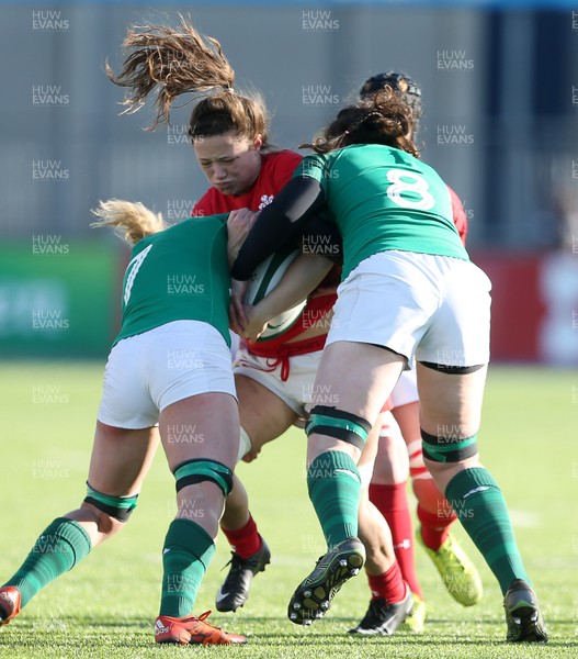 250218 - Ireland Women v Wales Women - Natwest 6 Nations - Alisha Butchers of Wales is tackled by Paula Fitzpatrick and Claire Molloy of Ireland
