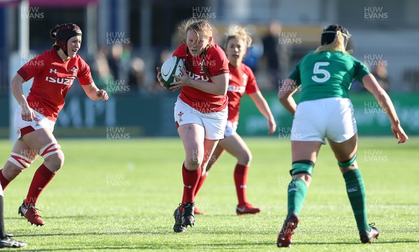 250218 - Ireland Women v Wales Women - Natwest 6 Nations - Carys Phillips of Wales is challenged by Orla Fitzsimons of Ireland