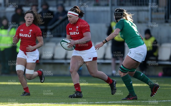 250218 - Ireland Women v Wales Women - Natwest 6 Nations - Amy Evans of Wales is challenged by Orla Fitzsimons of Ireland