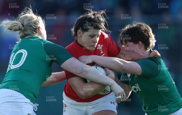 250218 - Ireland Women v Wales Women - Natwest 6 Nations - Rebecca De Filippo of Wales is tackled by Niamh Briggs and Ciara Griffin of Ireland