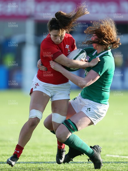 250218 - Ireland Women v Wales Women - Natwest 6 Nations - Alisha Butchers of Wales is tackled by Aoife McDermott of Ireland
