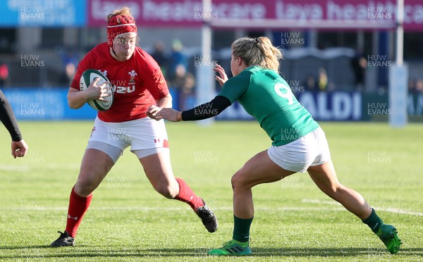 250218 - Ireland Women v Wales Women - Natwest 6 Nations - Carys Phillips of Wales is tackled by Ailsa Hughes of Ireland
