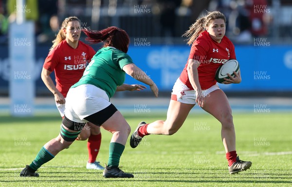 250218 - Ireland Women v Wales Women - Natwest 6 Nations - Hannah Bluck of Wales is challenged by Ciara O'Connor of Ireland