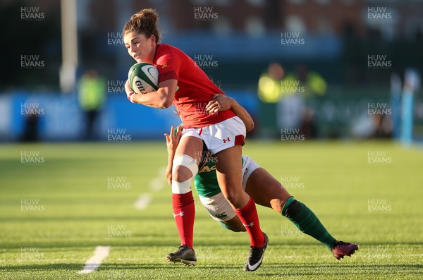250218 - Ireland Women v Wales Women - Natwest 6 Nations - Jess Kavanagh-Williams of Wales is tackled by Sene Naoupu of Ireland
