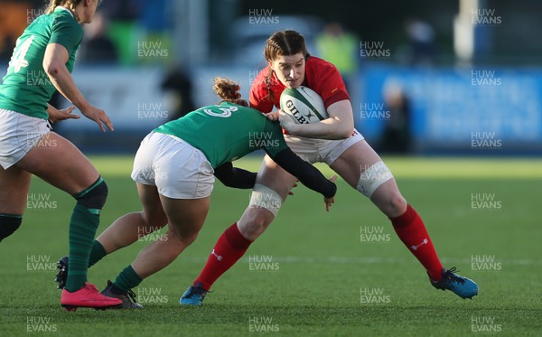250218 - Ireland Women v Wales Women - Natwest 6 Nations - Nia Elen Davies of Wales is tackled by Katie Fitzhenry of Ireland