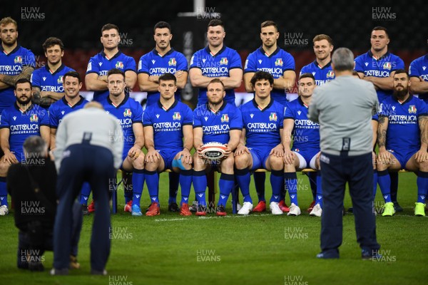 310120 - Italy Rugby Training - Luca Bigi holds a ball during a team pictures before training