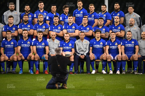 310120 - Italy Rugby Training - Luca Bigi holds a ball and sits alongside Franco Smith (right) during a team pictures before training