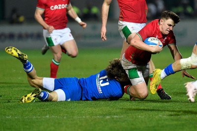 100323 - Italy U20 v Wales U20 - Under 20 Six Nations - Llien Morgan of Wales is tackled by Simone Brisighella of Italy 