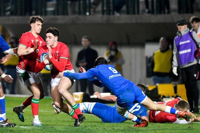 100323 - Italy U20 v Wales U20 - Under 20 Six Nations - Jac Davies of Wales is tackled by Sebastiano Battara of Italy 