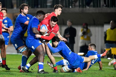 100323 - Italy U20 v Wales U20 - Under 20 Six Nations - Jac Davies of Wales is tackled by Fabio Ruaro and Sebastiano Battara of Italy 