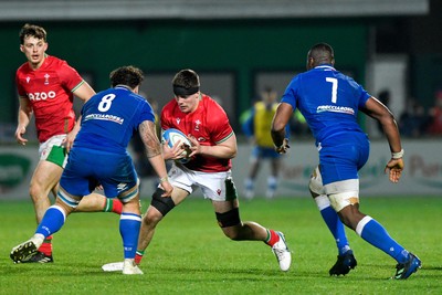 100323 - Italy U20 v Wales U20 - Under 20 Six Nations - Gwilym Evans of Wales is tackled by Jacopo Botturi and David Odiase of Italy 