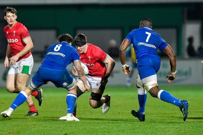 100323 - Italy U20 v Wales U20 - Under 20 Six Nations - Gwilym Evans of Wales is tackled by Jacopo Botturi and David Odiase of Italy 