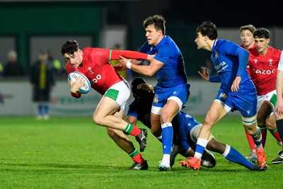 100323 - Italy U20 v Wales U20 - Under 20 Six Nations - Jac Davies of Wales is tackled by Giovanni Sante and Sebastiano Battara of Italy 