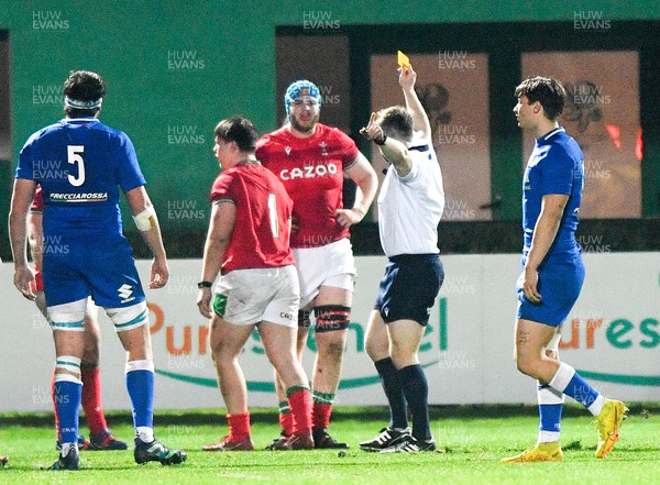 100323 - Italy U20 v Wales U20 - Under 20 Six Nations - Dylan Kelleher-Griffiths of Wales (1) is shown the yellow card by referee Anthony Woodthorpe 