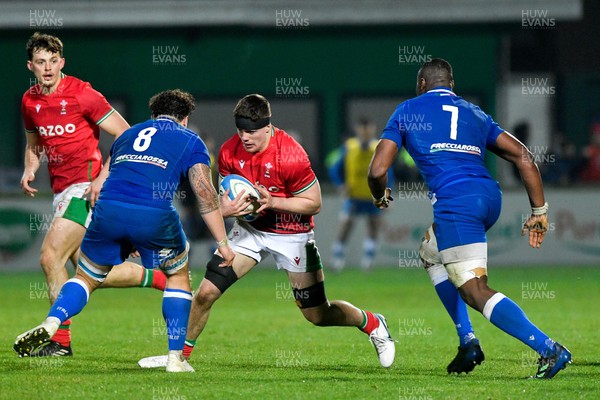 100323 - Italy U20 v Wales U20 - Under 20 Six Nations - Gwilym Evans of Wales is tackled by Jacopo Botturi and David Odiase of Italy 