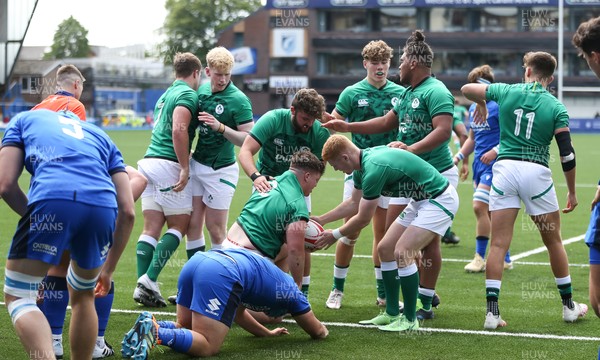 070721 - Italy U20 v Ireland U20, 2021 Six Nations U20 Championship - Eoin de Buitlear of Ireland is congratulated by team mates after  they power over to score the opening try