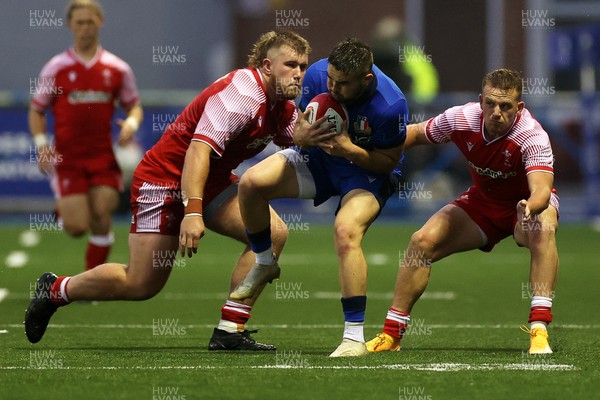 190621 - Italy U20s v Wales U20s - U20s 6 Nations Championship - Mattia Ferrarin of Italy is tackled by Garyn Phillips and Carrick McDonough of Wales