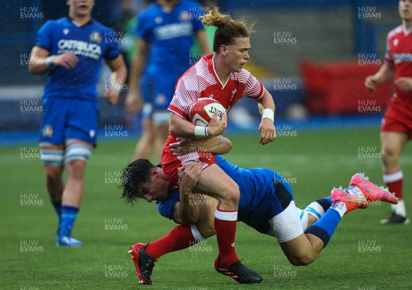 190621 - Italy U20 v Wales U20, U20 Six Nations - Harri Williams of Wales is tackled by Tommaso Menoncello of Italy as he looks to make a quick break for the line