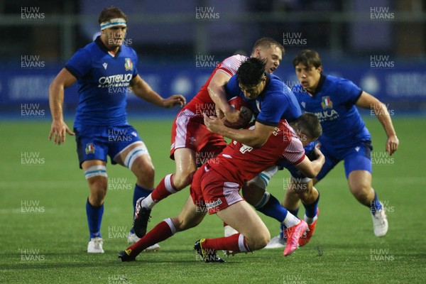 190621 - Italy U20 v Wales U20, U20 Six Nations - Tommaso Menoncello of Italy is tackled by Sam Costelow of Wales and Daniel John of Wales