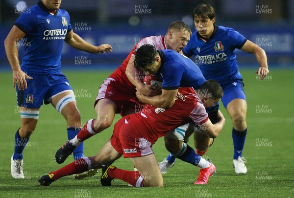 190621 - Italy U20 v Wales U20, U20 Six Nations - Tommaso Menoncello of Italy is tackled by Sam Costelow of Wales and Daniel John of Wales