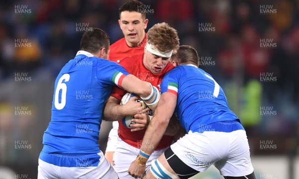 090219 - Italy v Wales - Guinness Six Nations - Aaron Wainwright of Wales is tackled by Sebastian Negri and Abraham Steyn of Italy