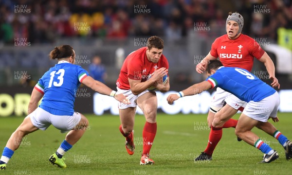 090219 - Italy v Wales - Guinness Six Nations - Jonah Holmes of Wales is tackled by Michele Campagnaro and Guglielmo Palazzani of Italy