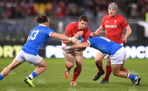 090219 - Italy v Wales - Guinness Six Nations - Jonah Holmes of Wales is tackled by Michele Campagnaro and Guglielmo Palazzani of Italy