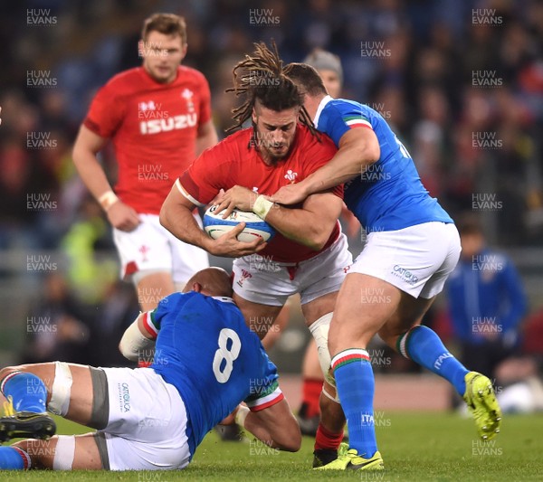 090219 - Italy v Wales - Guinness Six Nations - Josh Navidi of Wales is tackled by Sergio Parisse and Luca Morisi of Italy