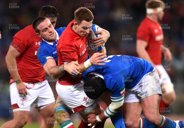 090219 - Italy v Wales - Guinness Six Nations - Liam Williams of Wales is tackled by Abraham Steyn and Simone Ferrari of Italy