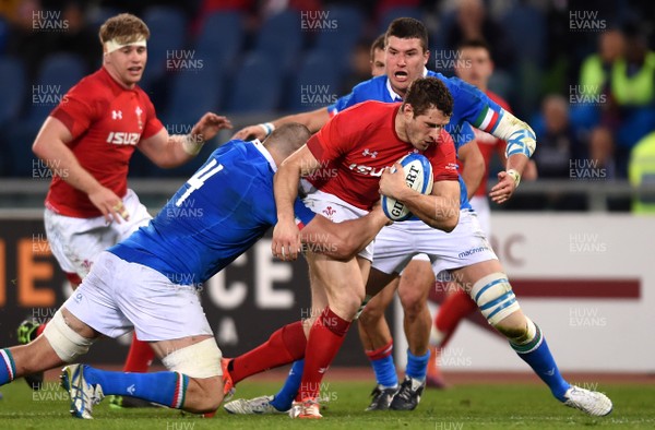 090219 - Italy v Wales - Guinness Six Nations - Jonah Holmes of Wales is tackled by David Sisi of Italy
