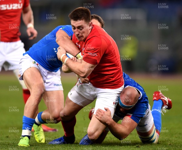 090219 - Italy v Wales - Guinness Six Nations - Josh Adams of Wales is tackled by Michele Campagnaro and Leonardo Ghiraldini of Italy