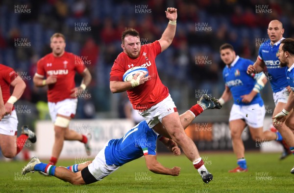090219 - Italy v Wales - Guinness Six Nations - Dillon Lewis of Wales is tackled by Edoardo Gori of Italy