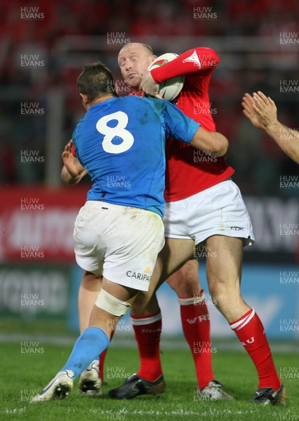 100307 - Italy v Wales - RBS Six Nations - Wales Gareth Thomas is stopped by Sergio Parisse