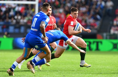 110323 - Italy v Wales - Guinness Six Nations - Joe Hawkins of Wales is tackled by Paolo Garbisi of Italy