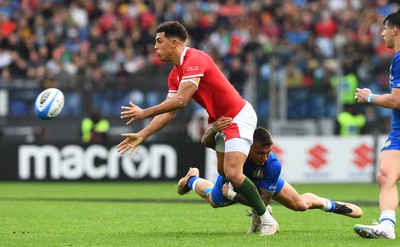 110323 - Italy v Wales - Guinness Six Nations - Rio Dyer of Wales is tackled by Pierre Bruno of Italy